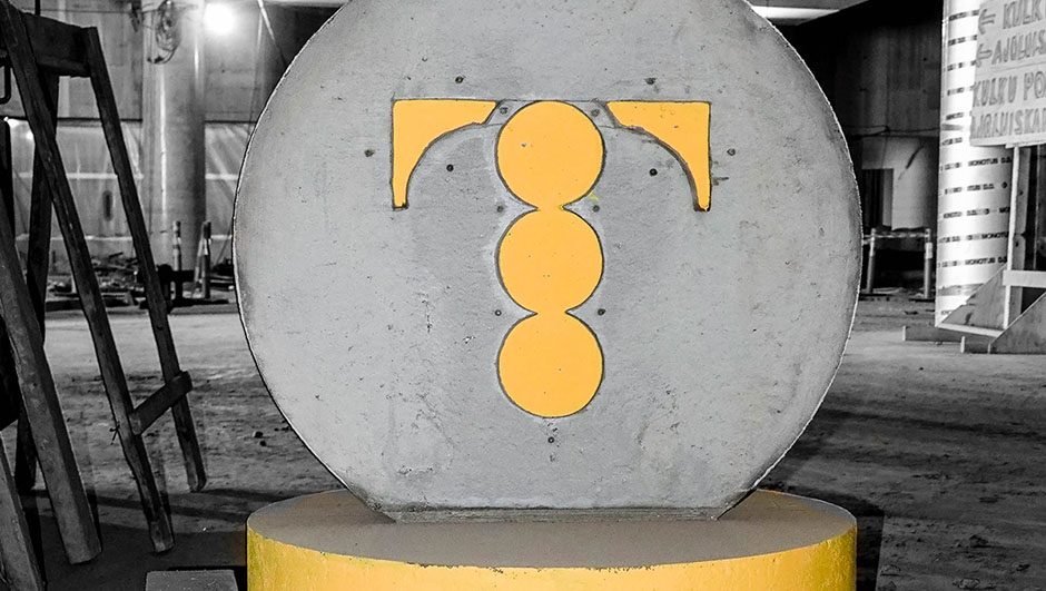 Concrete roadblock in the shape of a coin